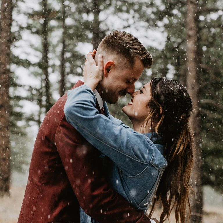 A kiss in the snow engagement photo