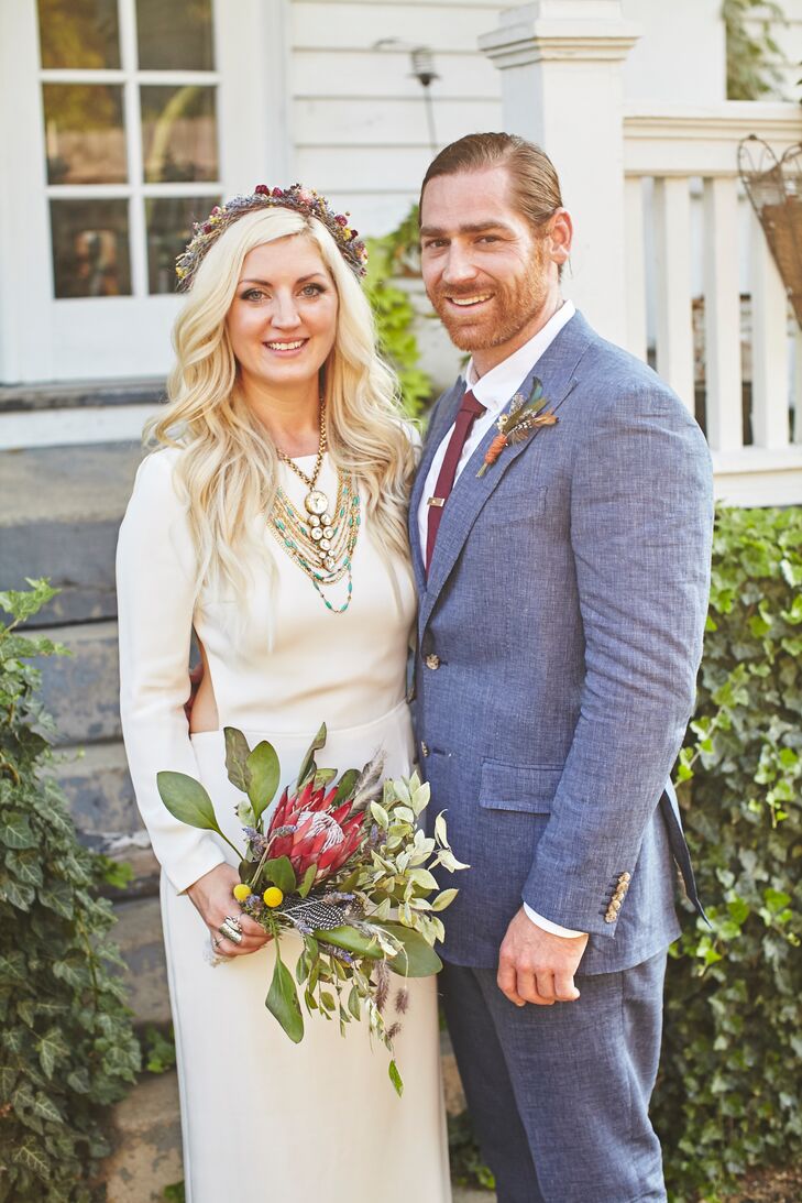 Angela paired the gown with a crown made of dried flowers, and a custom chapel-length veil made of white silk and vintage lace trim.