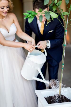 Bride and Groom Watering Tree During Unity Planting Ceremony