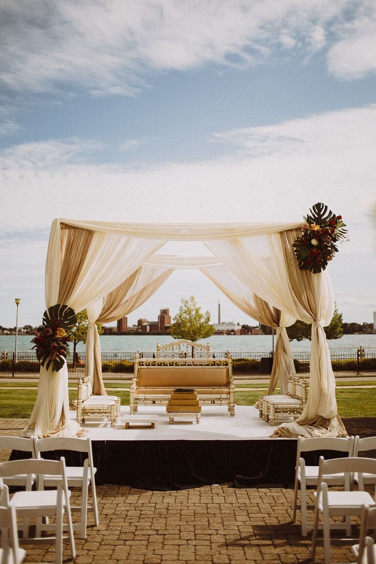 Beige mandap with Monstera leaf accents