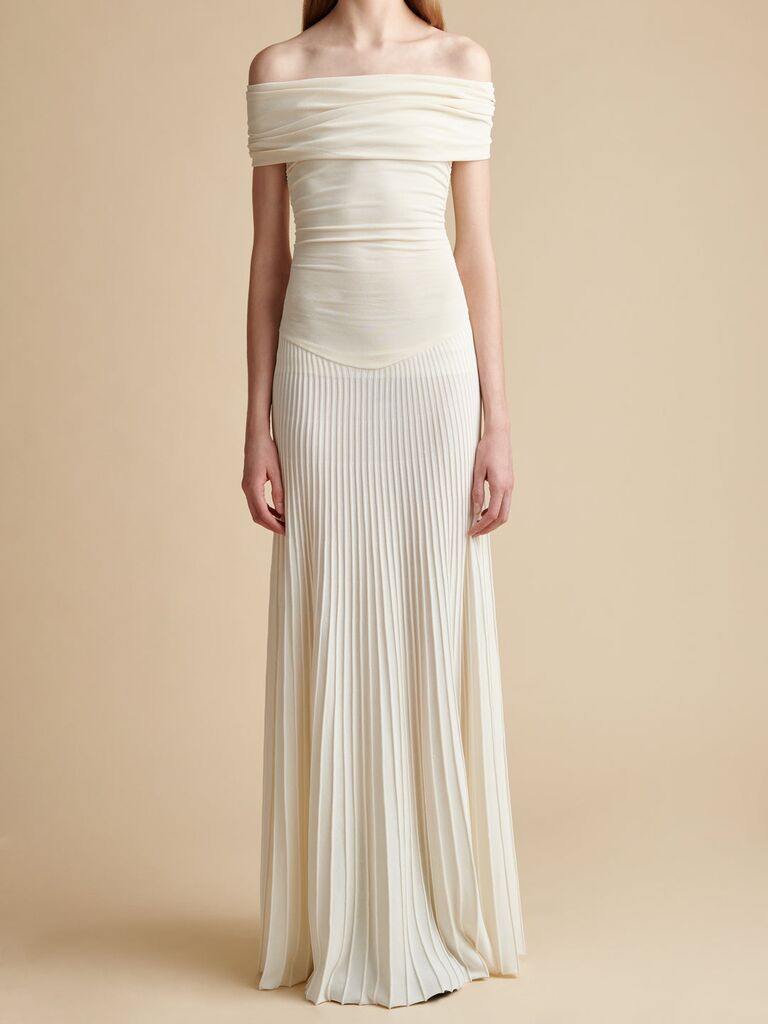 Off-the-shoulder drop waist dress with a pleated skirt. 