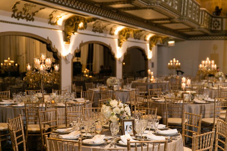 The wedding color palette consisted of navy, gold and ivory. “We went heavy on the candlelight in the reception space to give a very romantic and soft look," the bride explains.