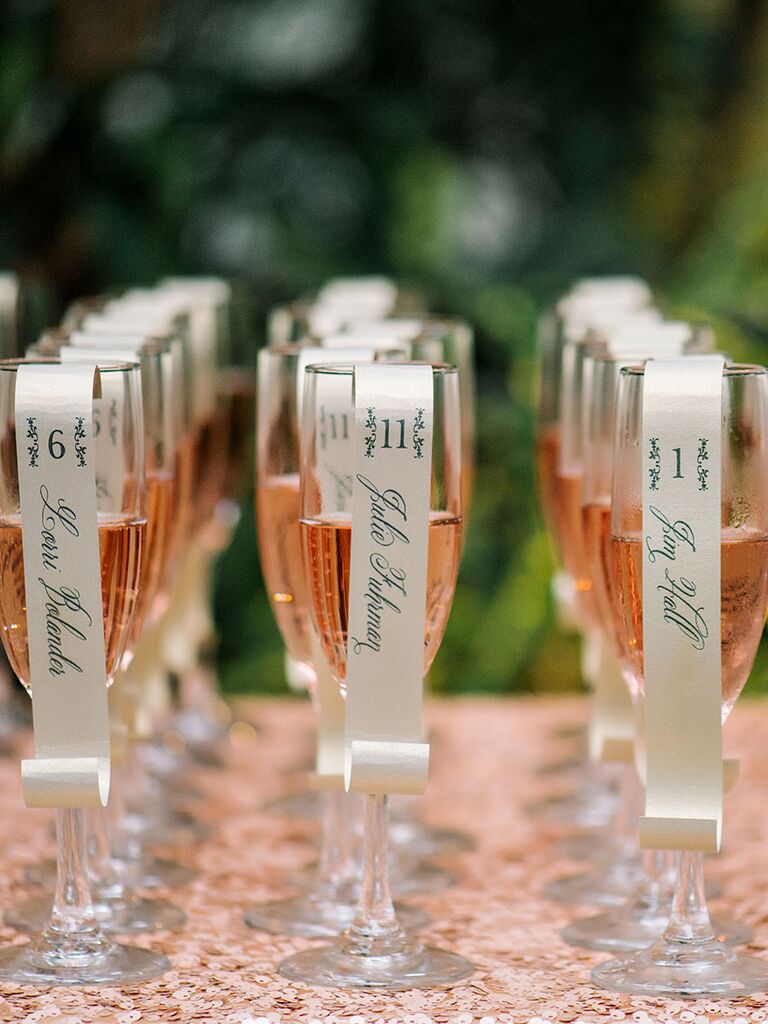 Glasses of champagne as wedding escort cards