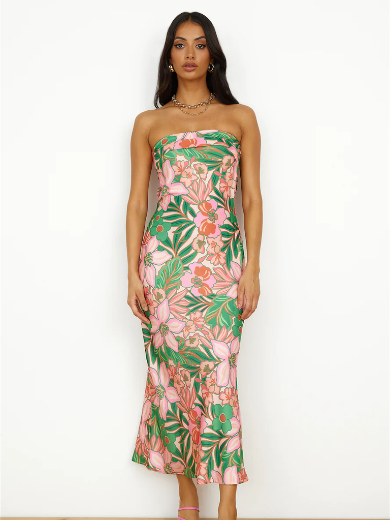 A model wears this strapless tropical-flower print gown.