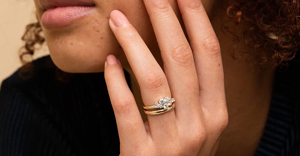 Gold Wedding Rings on a Glass Surface · Free Stock Photo