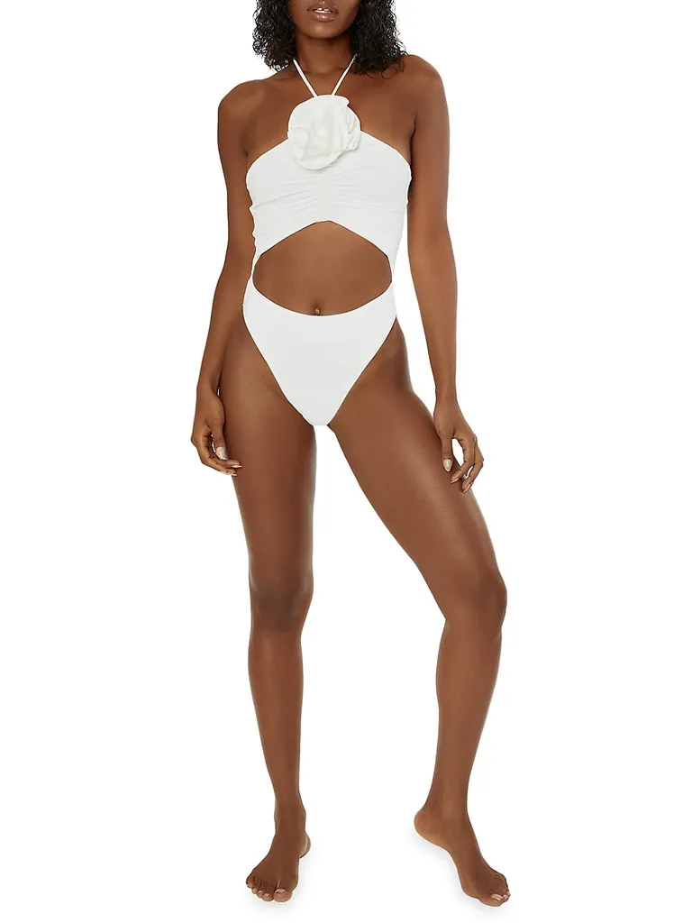 cutout white one piece with halter top and statement flower