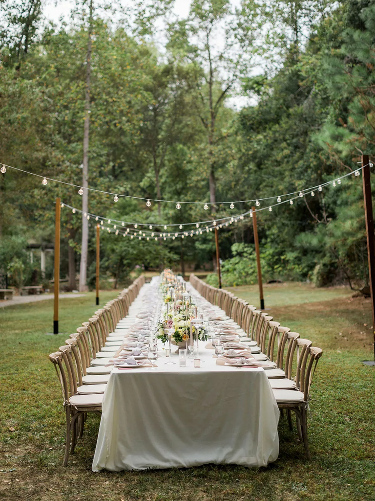 The tables are set at this beautiful cream-toned wedding reception.