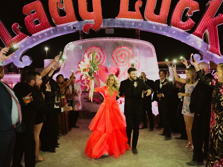 Guests use cell phone flashlights for the ceremony exit. 