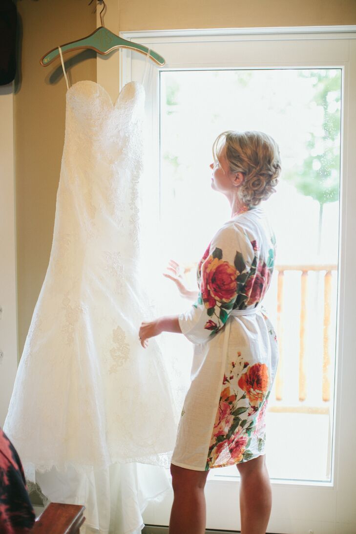 Bride Getting Ready in Strapless Lace Fit and Flare Allure Wedding Dress