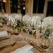 Clear Glass Chargers and Gold Flatware