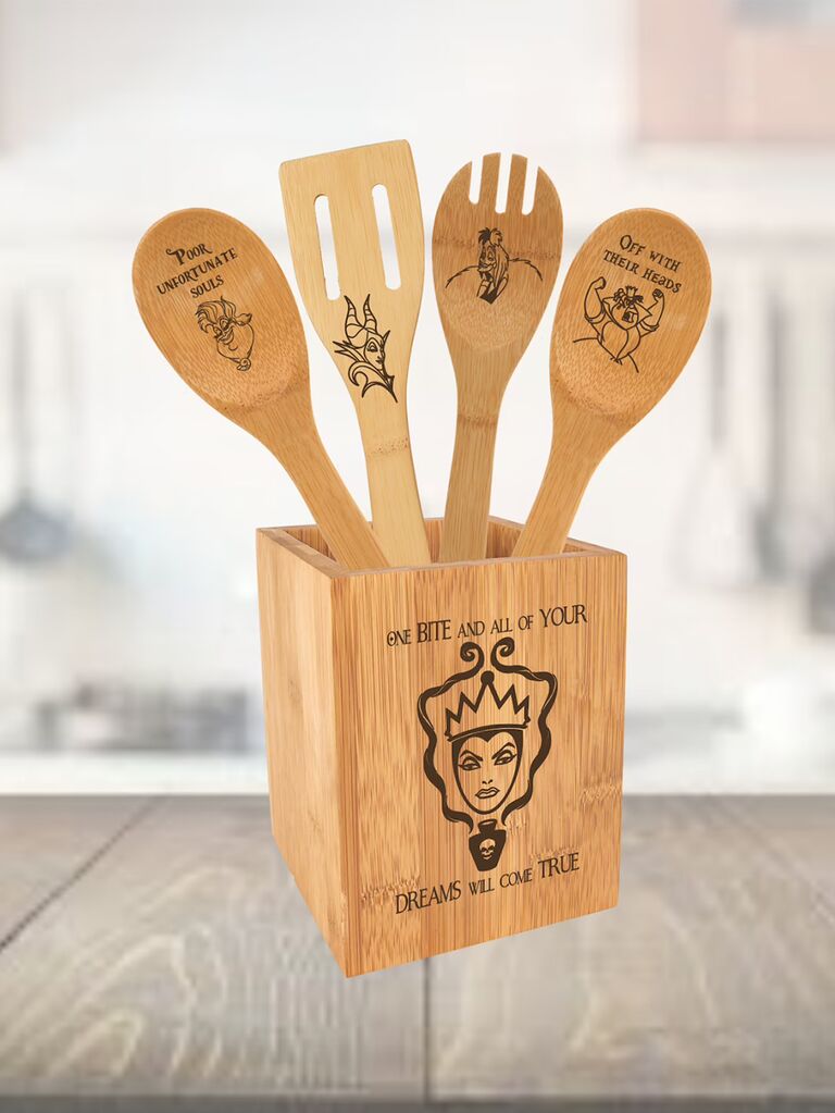 Snow White queen graphic on wooden utensil holder with Disney villans on utensils