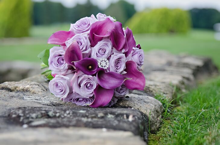 The bridesmaids carried lavender roses and plum calla lilies in their lush bouquets. The flowers were accented with round crystals to match the sparkly theme of the wedding. Mariel wanted all the floral arrangements to exude romance, and Ray's Flower Shop did a wonderful job bringing her vision to life.