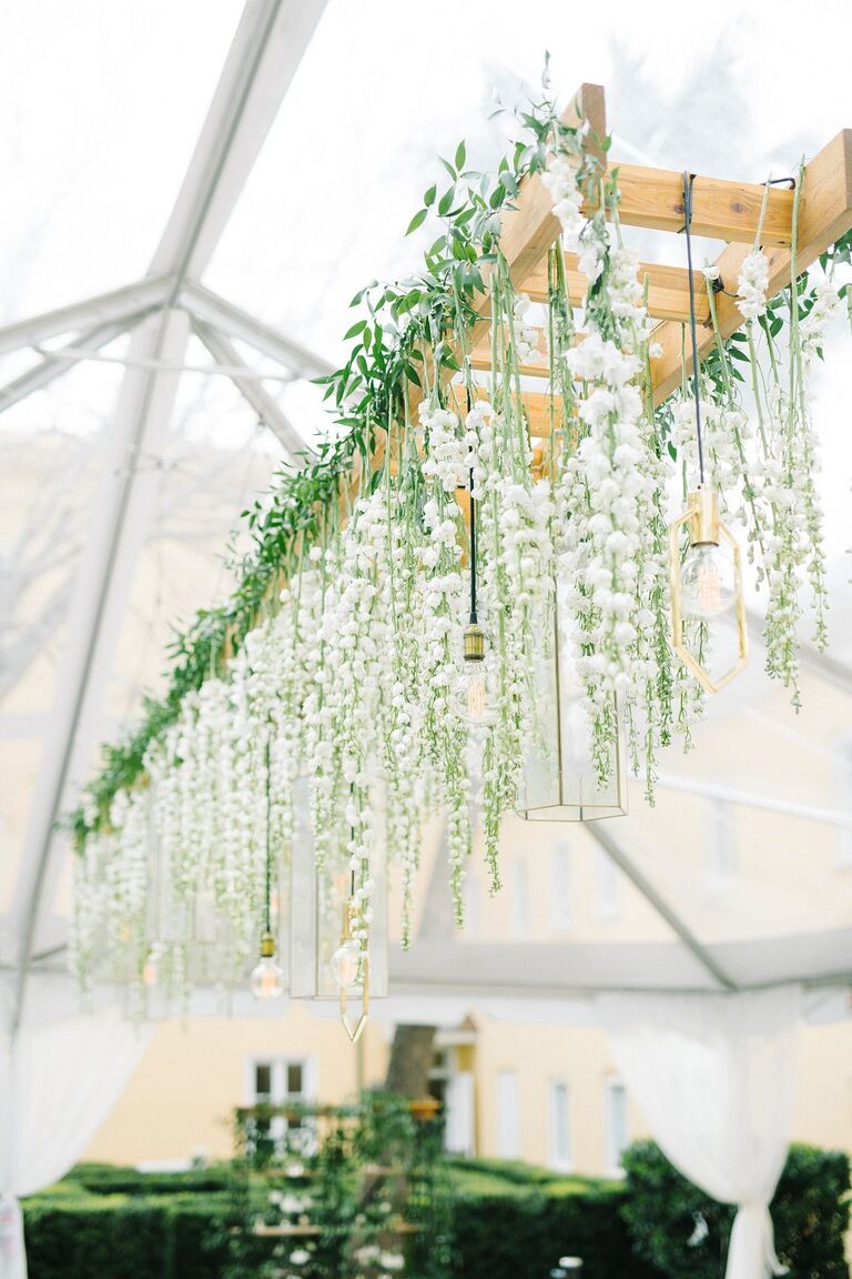 Hanging ladder with delphinium blooms and pendant lights
