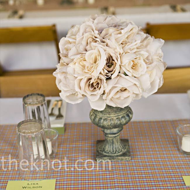 The centerpieces were from Jen’s brother’s wedding three years earlier! The fake (gorgeous) blooms had been sitting in their family’s storage unit.