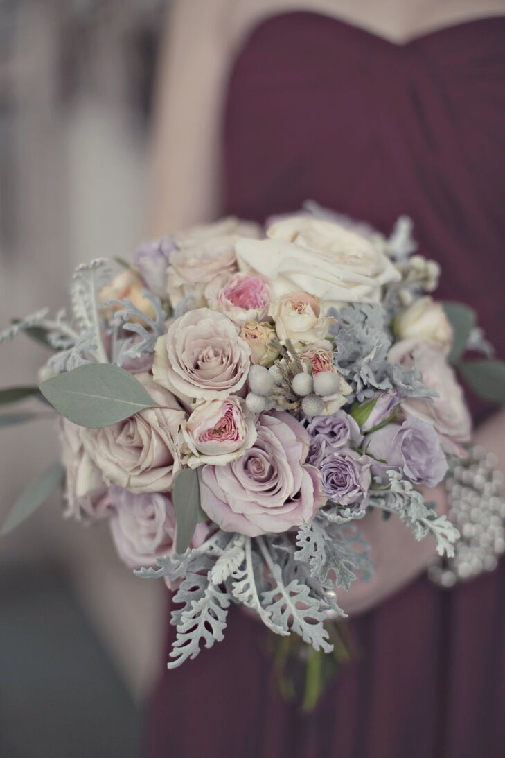 Romantic roses, brunia berries and eucalyptus leaves were combined to create the pastel bridesmaid bouquets.