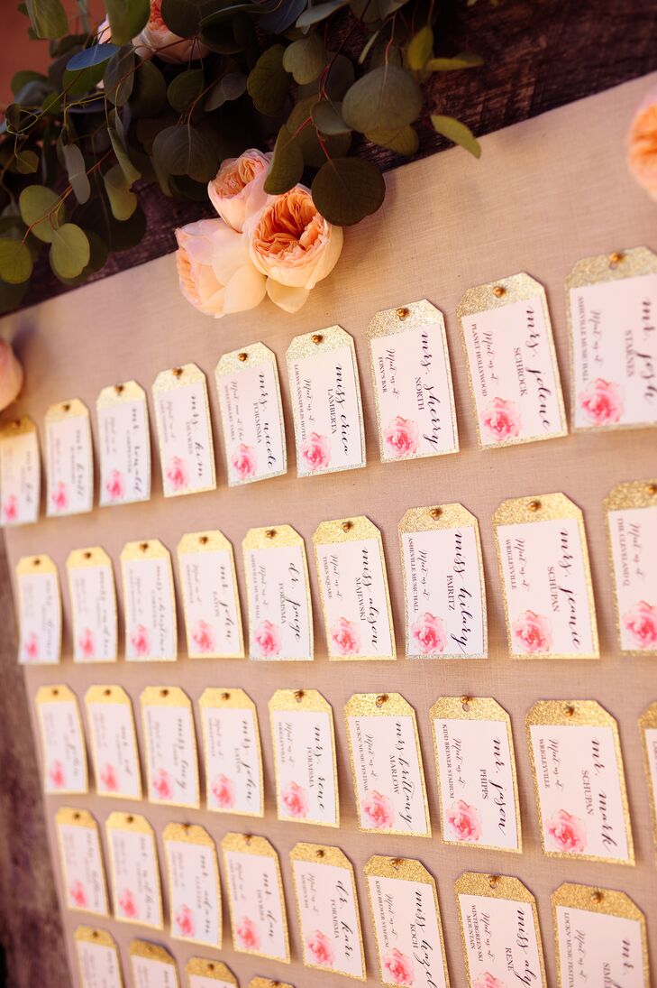The escort cards were luggage tags, each listed with a table that corresponded with a place Nicole and Derek have traveled together.