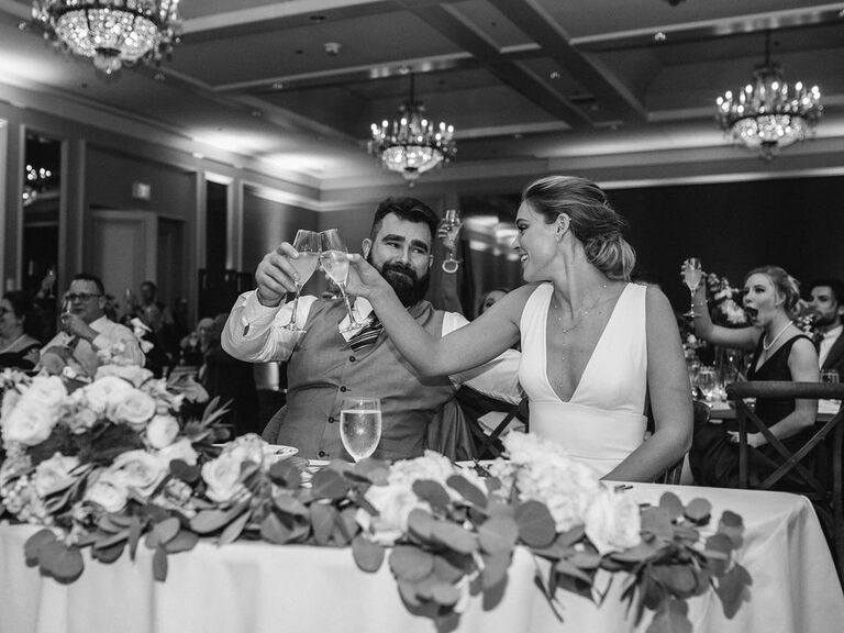Jason and Kylie Kelce toasting on their wedding day