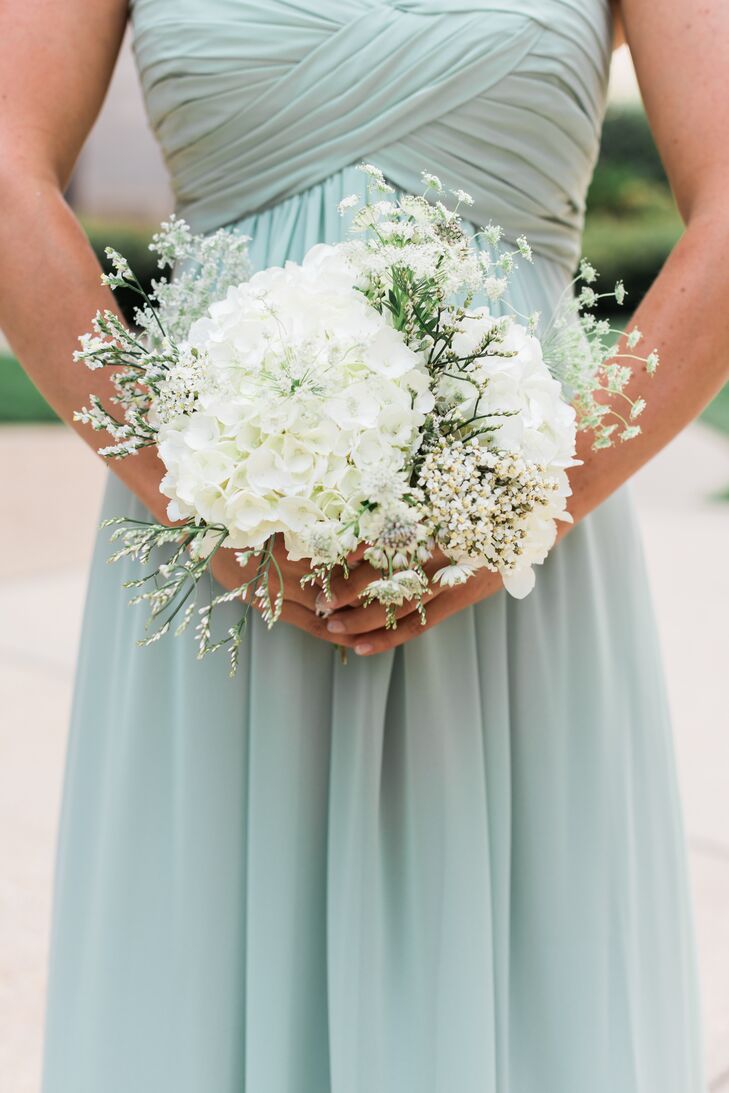 The bridesmaids carried white hydrangeas, scabiosas, Queen Anne's lace and wildflowers in their lush bouquets. Mary Kait and Chris wanted all the details to be textured and organic-looking, and Simply Elegant Floral Designs nailed it.