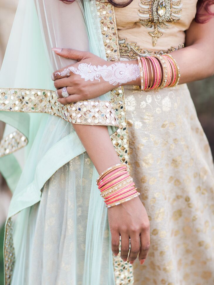 "I was decorated head to toe in the most gorgeous traditional Indian jewelry," says Arselie. "Earrings, bangles, jewels on my fingers, jewels over my eyebrows, and three necklaces—and I loved my headpiece so much I wore it the entire night!"