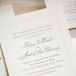 Lindsay and Jake's traditional, calligraphed wedding invitations with pearl beading borders were provided by Write For You.