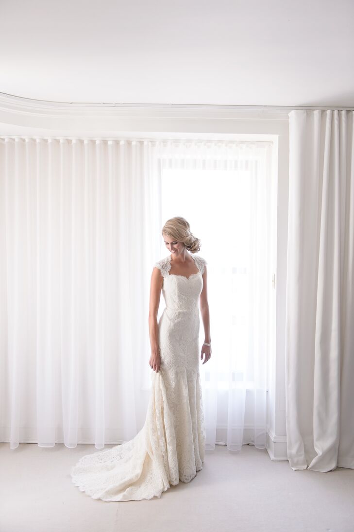 Christina wore a white lace wedding dress by designer Anne Barge from the Mark Ingram Atelier in New York City. "I had the most amazing consultant there," she says. Salon Buzz completed her classic bridal look with an intricate, twisted, sideswept bun.