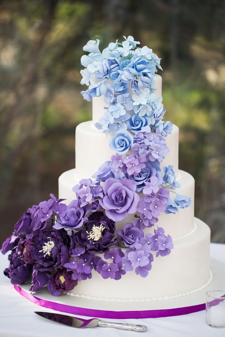 "Renowned cake baker Ana Parzych worked with us to design the most magnificent—and best tasting—cake our guests had ever seen, featuring handmade sugar flowers cascading down four tiers in an ombre theme of blues and purples," Lisa says. "Each tier had a different flavor combination, and each guest had the chance to taste all three."
