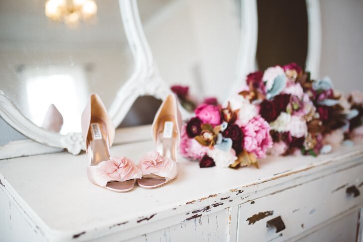 Wanting her wedding day kicks to complement her bridesmaid dresses, Morgan opted for a pair of blush satin Badgley Mischka heels with a peep-toe silhouette and flirtatious floral embellishments. “When I saw them, I knew I had found my shoe,” Morgan says.