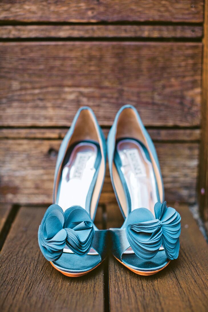 For her "something blue," Kimberly wore a teal stain pair of peep-toe pumps with silk rosettes.
