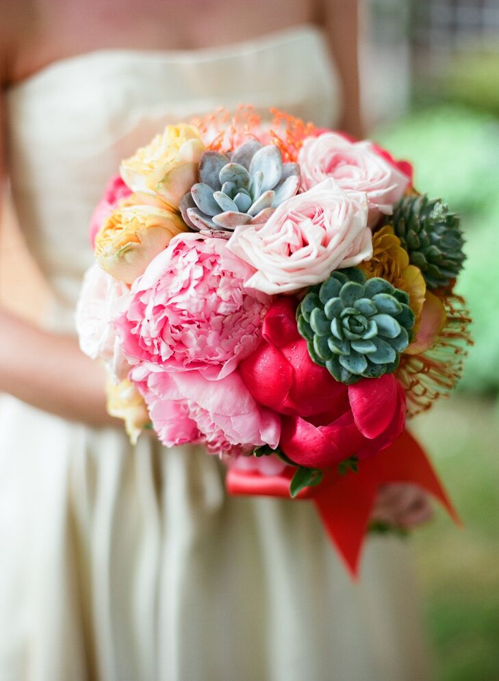 The day's color palette centered around Krissy's bouquet of peonies, roses, succulents and pincushion protea.