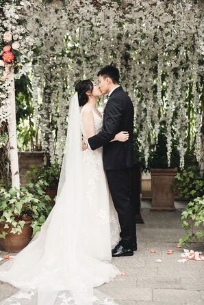 Wedding Ceremony First Kiss at Planterra Conservatory in Detroit, Michigan
