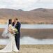 Pam wore a fit-and-flare Anne Barge dress with allover lace appliques and a neutral underlay that fit the fall season. She added lace short sleeves for the outdoor mountaintop ceremony, but wore the gown strapless for her reception.