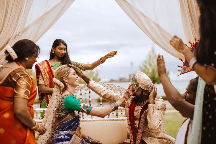 Couple Placing Hands on Each Other During Hindu Wedding Ceremony
