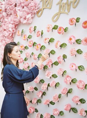 Wedding Guest at Rose-Inspired Escort Card Display