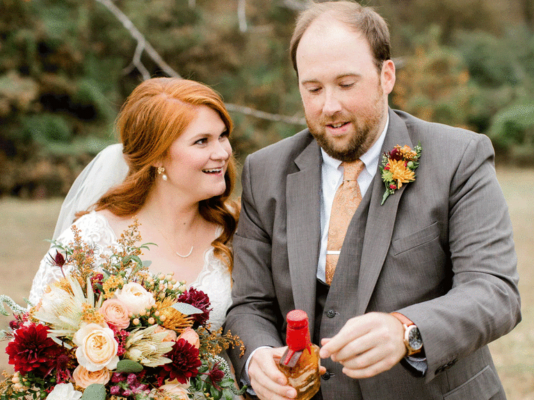 Newlyweds doing burying the bourbon Southern wedding tradition.