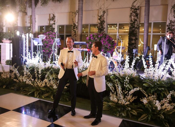Grooms in White Tuxedo Jacket, Black Slacks on Checkered Dance Floor, Large White Arrangements