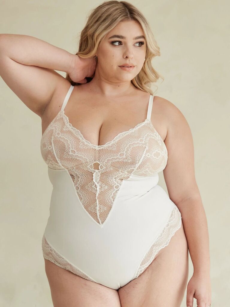 Model wearing white lacy shaping bodysuit for under wedding dress