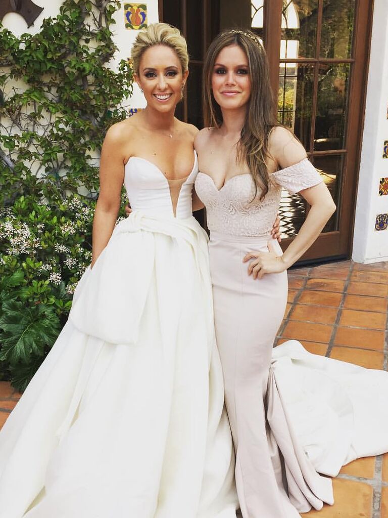 Rachel Bilson smiles with the bride. 