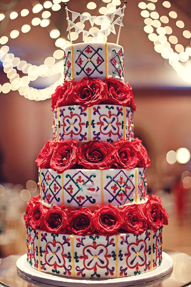 “We had a three-tier cake with red roses, and it was a Spanish tile inspired design that incorporated the colors of our wedding,” says Ariel. “We used buttercream frosting with one layer being lemon, another being strawberry cream, and the last layer comprised of white cake.”