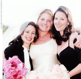 Suzy walked down the aisle, accompanied by her sisters, who served as honor attendants.