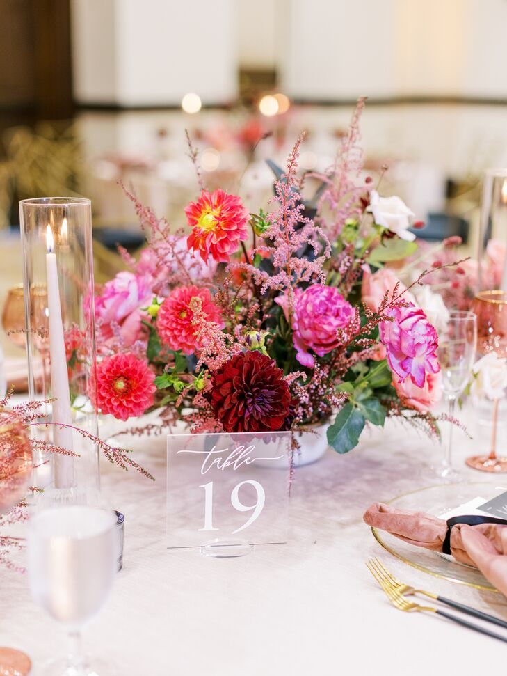 Pink-and-Red Centerpiece With Dahlias Beside Acrylic Table Number