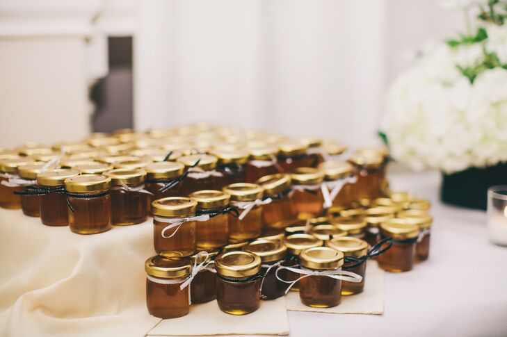 Honey in small jars from Christina's uncle's family farm served as wedding favors. A simple bow around the lid was a sweet touch for the DIY favor.