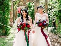 Newlyweds under botanical archway in Florida