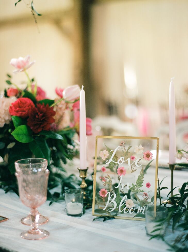 "To incorporate our floral 'Love in bloom' theme, we made individually pressed flower coasters with our guests’ names and table numbers as escort cards, which doubled as favors," Deborah says.