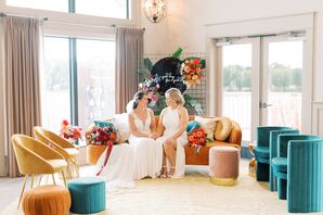 Brides Sitting on Velvet Couch in Reception Lounge Area