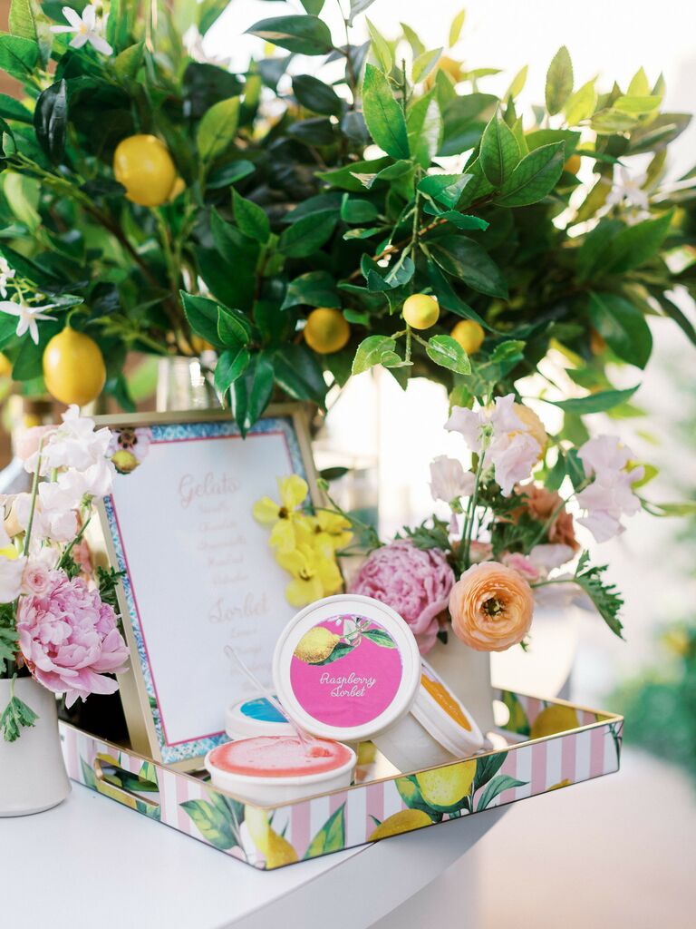 miniature tubs of gelato with colorful pink and yellow striped serving tray and lemon branch centerpieces