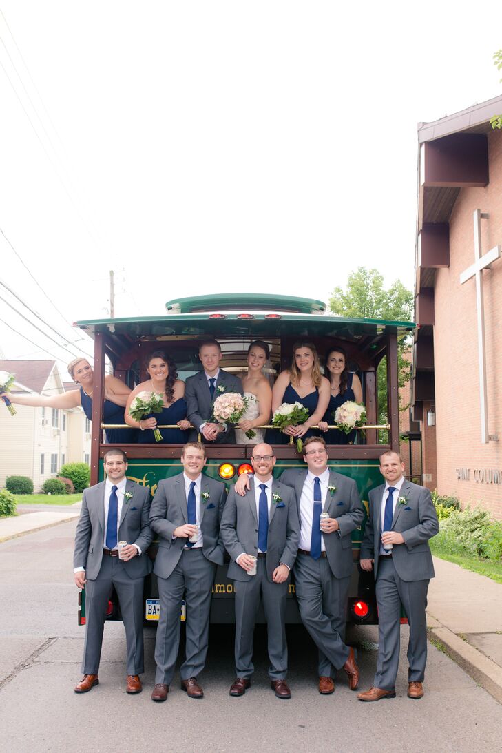 Even their transportation was vintage. While guests flocked to the Pine Barn Inn in Danville, Pennsylvania, Emily, Chris and their wedding party rode to the reception in a vintage trolley car with Allie Skylar Photography. The groomsmen were dressed to impress in gray suits from Men’s Wearhouse and navy ties that perfectly matched the bridesmaid dresses.
