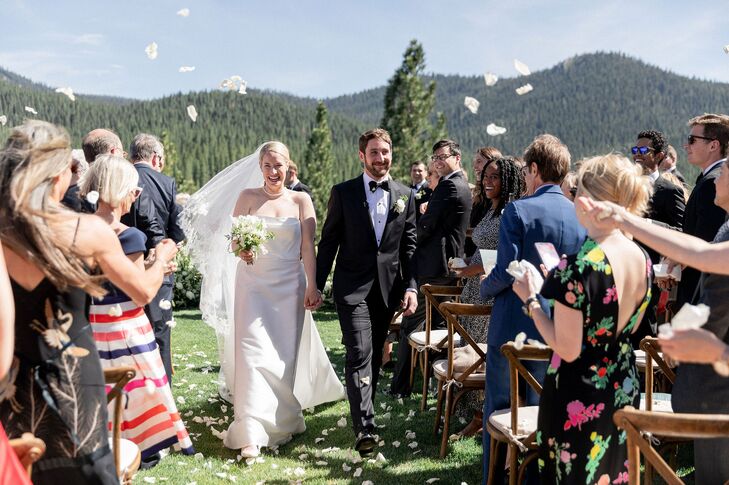 Couple Recessing Under Cascade of Rose Petals at Martis Camp in Truckee, California