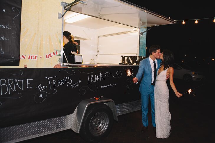 At the end of the evening, Molly surprised Michael with a food truck. "One of my favorite details was my surprise for Michael. He is really obsessed with late-night food. He always mentioned how he wanted late-night food served at the wedding, and I would just tell him we had enough food," Molly says. "When we made our sparkler exit at the end of the night, sitting at the end was a hot dog truck that read 'Celebrate the Franks with a frank!' "