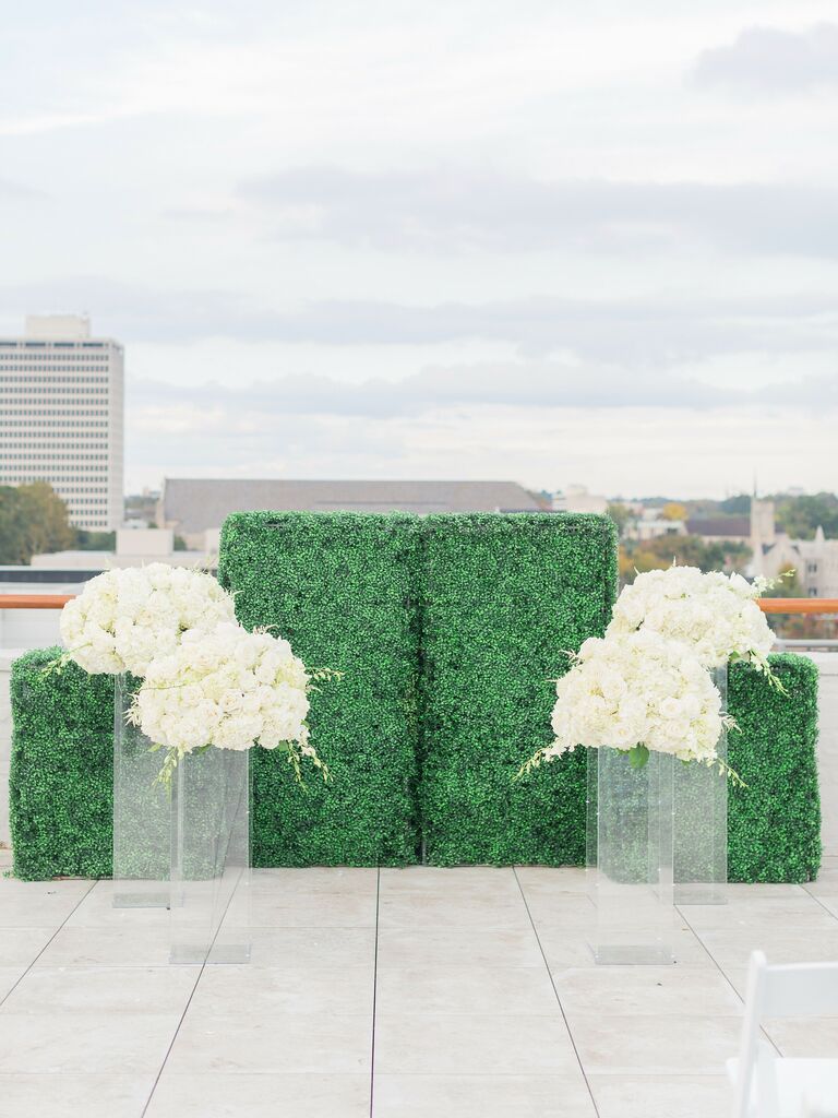 wedding arch alternative boxwood wall with white flowers