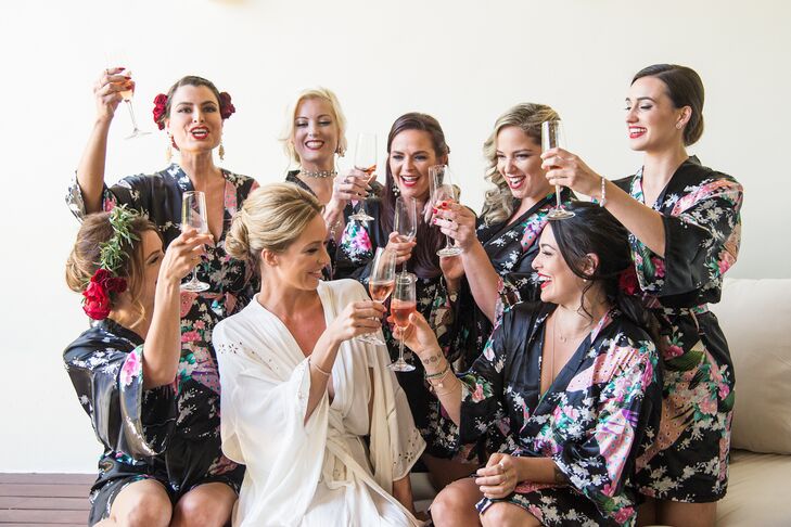 Michelle's bridesmaids were given chic black dressing gowns with floral motifs before they changed into white gowns for the ceremony.